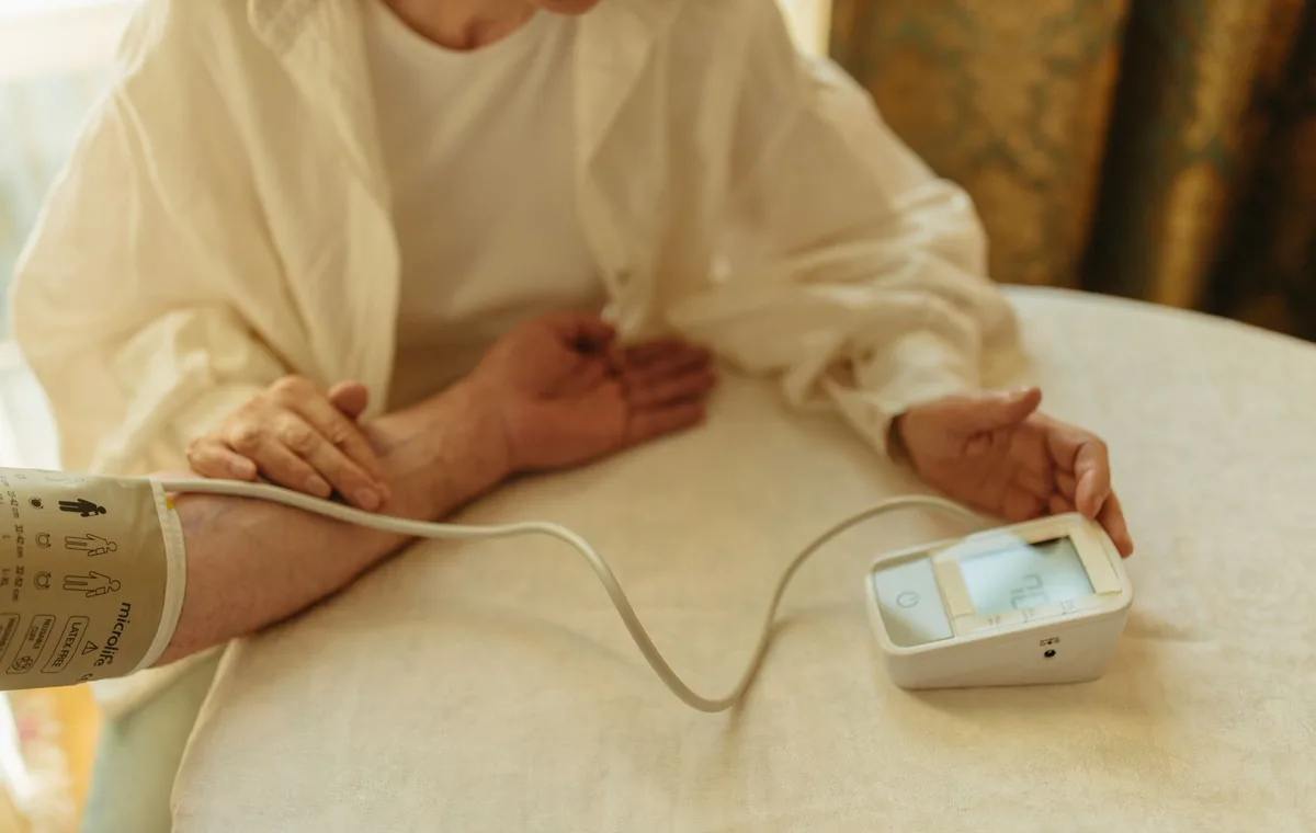 A nurse caring for a patient at home
